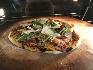 homemade pizza with meatballs pepperoni garlic parmesan arugula