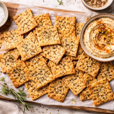 Crispy sourdough discard crackers with seeds and herbs, easy homemade snack recipe